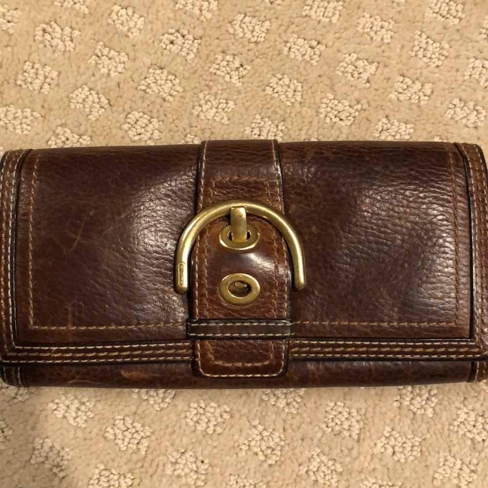 Coach brown leather wallet with gold buckle detail